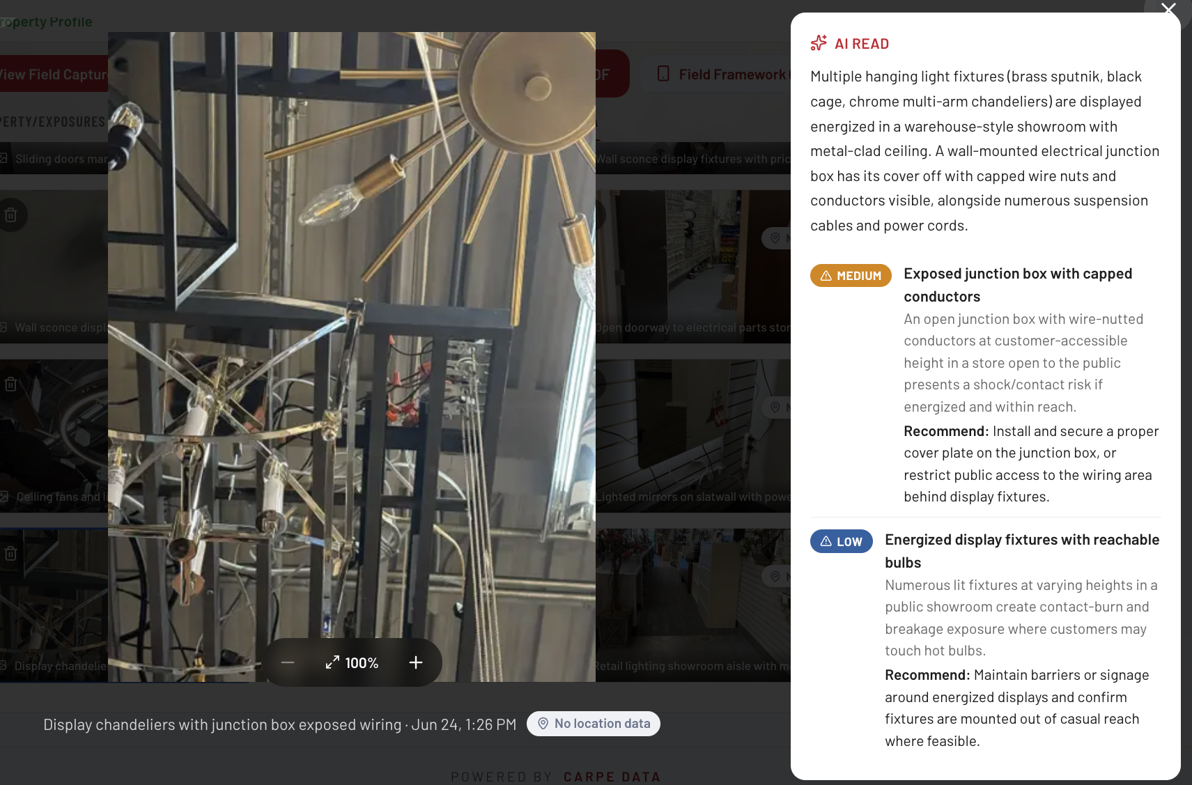 Carpe Risk Control AI Read media panel, showing a captured photo of display chandeliers with exposed junction-box wiring alongside an AI-drafted read that grades a Medium exposed junction box hazard and a Low energized display fixtures hazard, each with a recommendation